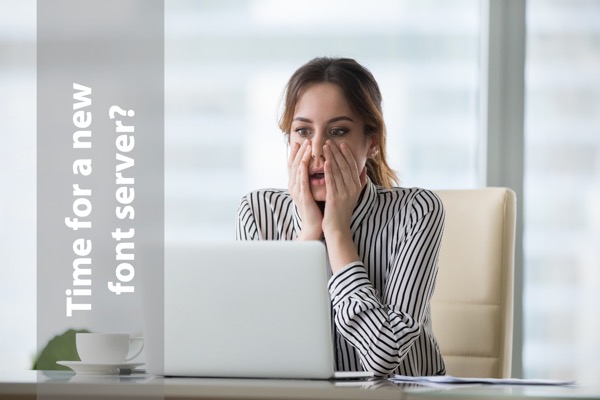 Image of astonished woman using a laptop