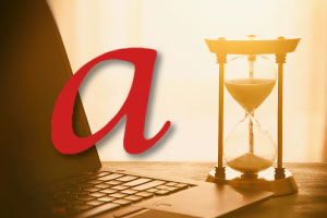 Image of a red a icon floating over an old picture of a laptop and an hourglass depicting how time is running out for old PostScript Type 1 fonts