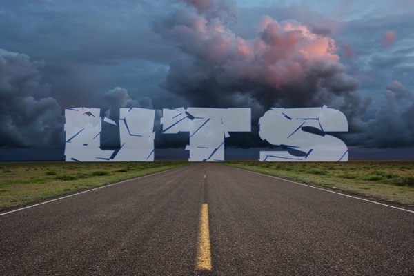 Image of stormy road leading to the horizon with cracked letters spelling 